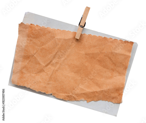 old blank note paper with clothes pin on white background