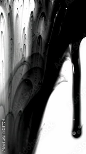 Extreme macro video of viscous obsidian black ink bleeding, diffusing, forming feathery tendrils on pristine white, transforming to black. Abstract fluid art transition