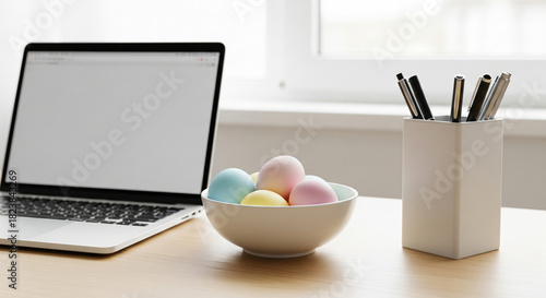 Easter holiday laptop mockup. On the table is an open laptop with an empty screen, and next to it is a basket of Easter eggs. Presentation of the website. Online shopping for Easter.
