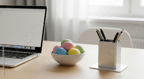 Easter holiday laptop mockup. On the table is an open laptop with an empty screen, and next to it is a basket of Easter eggs. Presentation of the website. Online shopping for Easter.