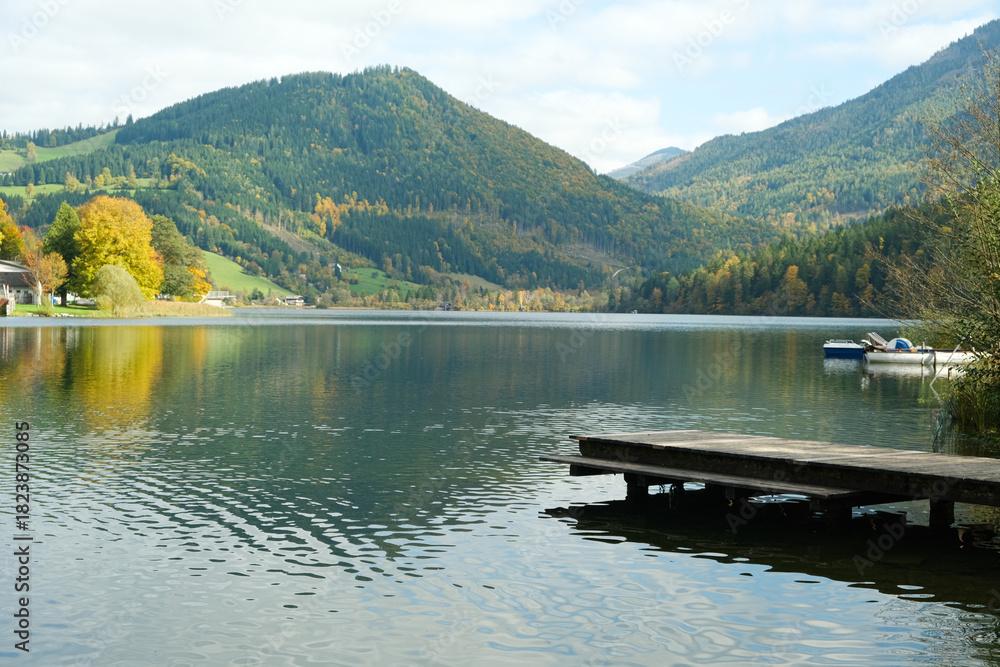 Fototapeta premium Autumn mountain landscape, mountains near lake, reflections in the water.