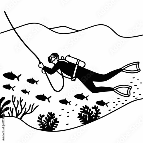 Scuba diver swimming with school of fish near coral underwater diving