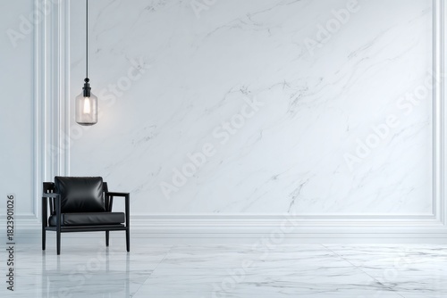 Minimalist interior space features a modern black armchair against a large white marble wall