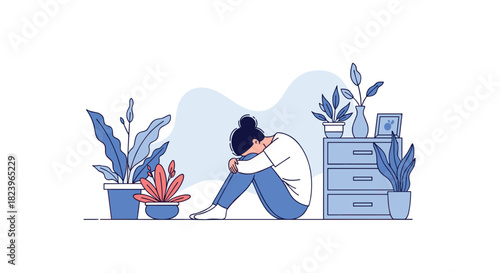 Sad and lonely woman sitting on the floor with her head down surrounded by houseplants illustrating depression and mental health.