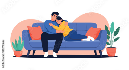 Loving young couple cuddling on a comfortable sofa at home in a cozy and romantic scene with houseplants in the background.