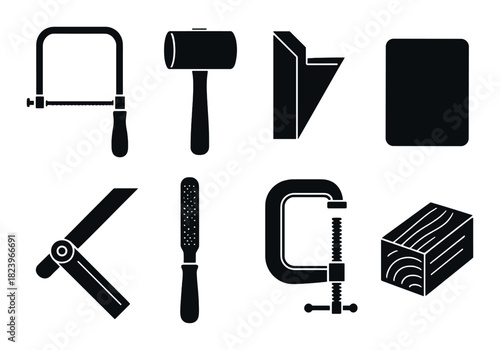 Silhouette of woodworking tools on dark wooden background