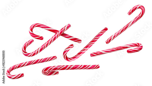 Christmas candy canes flying on a white background. Isolated