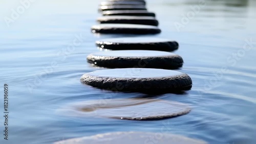 Stepping Stones Pathway Across Calm Blue Water Leading Forward