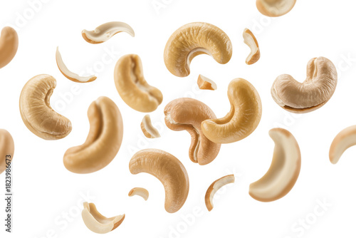 Delicious whole and broken cashew nuts in motion, healthy food