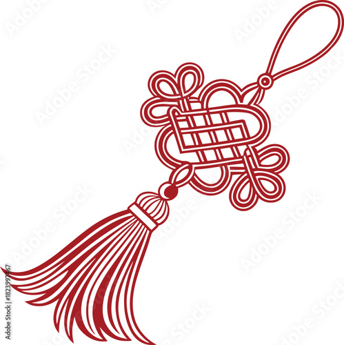 Red chinese knot with tassel on isolated black background, traditional decoration
