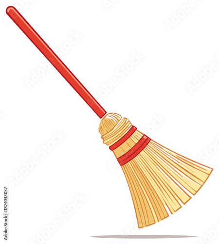 Red handled broom with straw bristles for cleaning