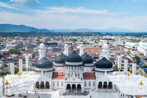 Banda Aceh city cityscape, drone aerial view in Indonesia, with Aceh Grand Mosque, Baiturrahman Grand Mosque