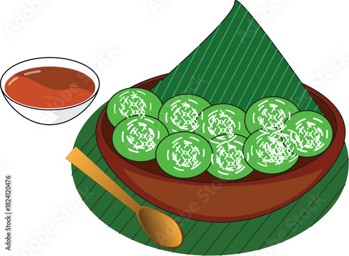 Klepon or sweet glutinous rice balls with palm sugar on green leaf. Traditional Indonesian dessert