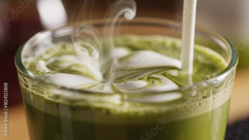 Wallpaper Mural Pouring Cream into Matcha Latte A CloseUp of a Refreshing Green Tea Beverage with Cream Being Added Creating a Swirling Pattern in a Glass. Torontodigital.ca