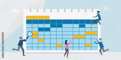 Team collaborating on a large calendar or schedule