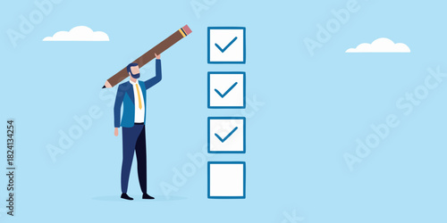 Businessman completing a checklist with a large pencil
