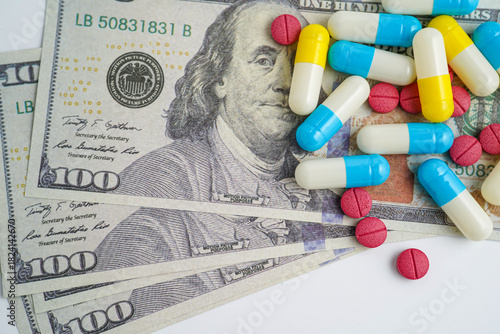 Pills on money dollars, Medicine prescription drugs cost concept, healthcare expenses