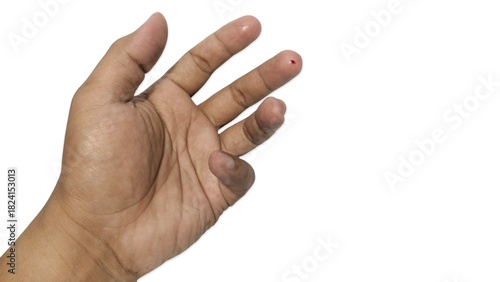 Blood drop on middle finger tip for diagnostic testing or minor injury. Isolated image against a white background.