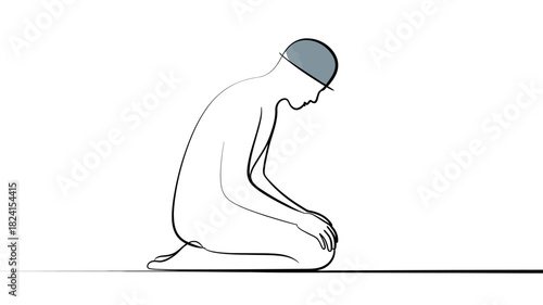A solitary individual performs a religious prayer, bowing in a moment of contemplation and devotion.