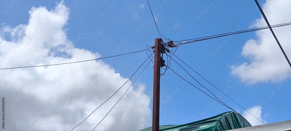 Fototapeta premium Electric poles and blue sky