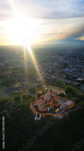 Aerial drone view of the Great Pyramid and Church of Our Lady of Remedies in Cholula, Mexico. Vertical