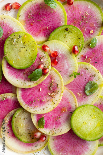 Fresh salad with sliced watermelon radish top view
