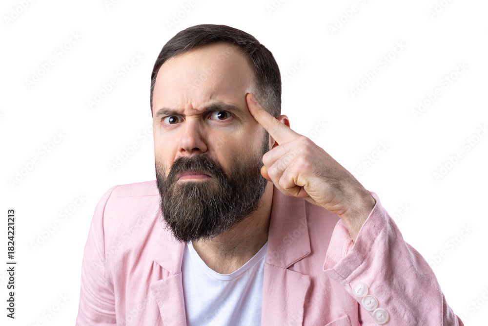 Obraz premium Handsome man with a beard in a pink jacket is thinking over an isolated red background.
