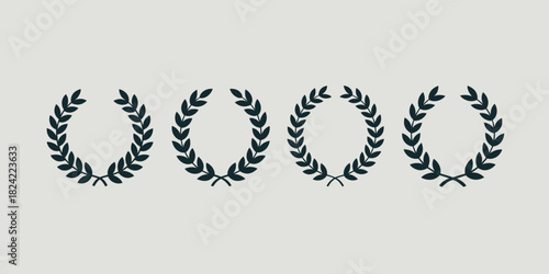 Four black laurel wreaths on a light background