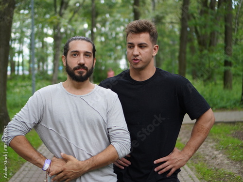 portrait of two happy man in a park