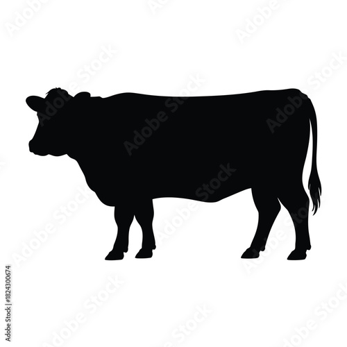 Black silhouette of a standing cow on a white background