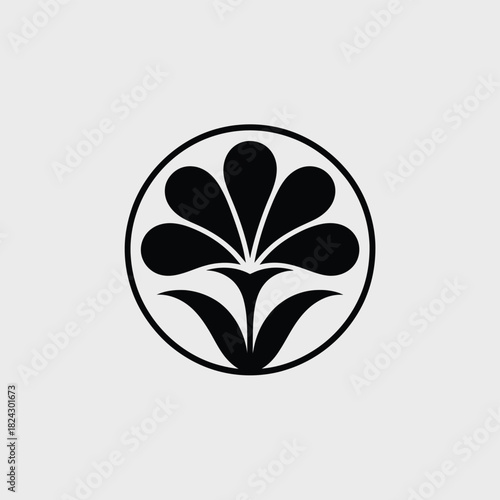 Stylized black flower silhouette inside a circle on gray background