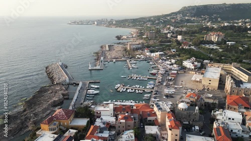 Aerial perspective showcases panorama of Batroun, Lebanon at dusk.
