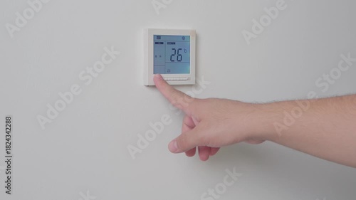 Adjust temperature at remote control with display for using air conditioner, close up. High quality 4k footage