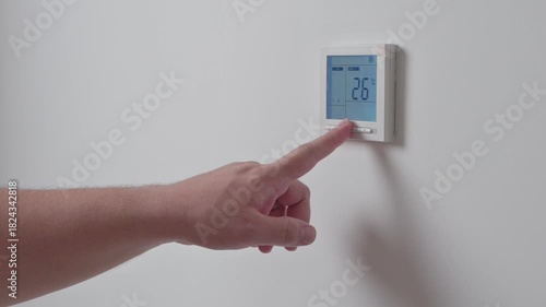 Adjust temperature at remote control with display for using air conditioner, close up. High quality 4k footage