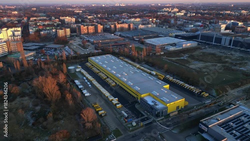 Wallpaper Mural Long yellow DHL distribution center Berlin. Smooth aerial view flight drone Torontodigital.ca