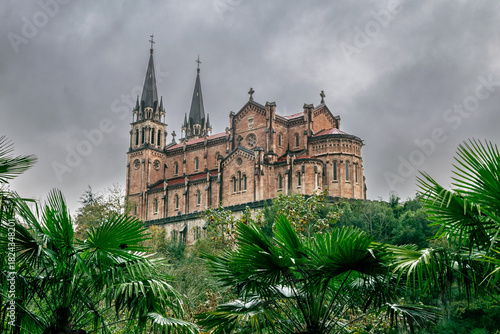 Neo-Romanesque Church Architecture Basilica de Santa María la Real de Covadonga with Cloudy Landscape