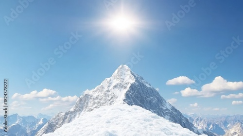 Bright sun shines above a majestic snow covered mountain peak under clear blue sky