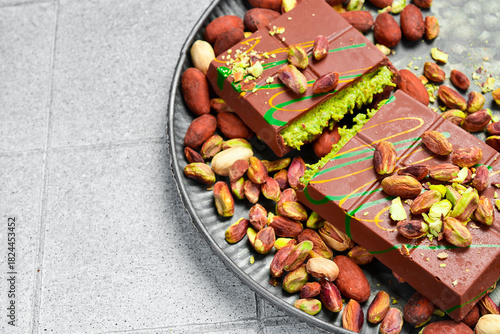 Dubai chocolate with pistachio paste and kataifi dough. Free space for text.