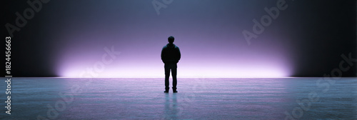 Silhouette of man standing alone against dramatic purple light. dark background enhances feeling of mystery and loneliness, facing an unknown future