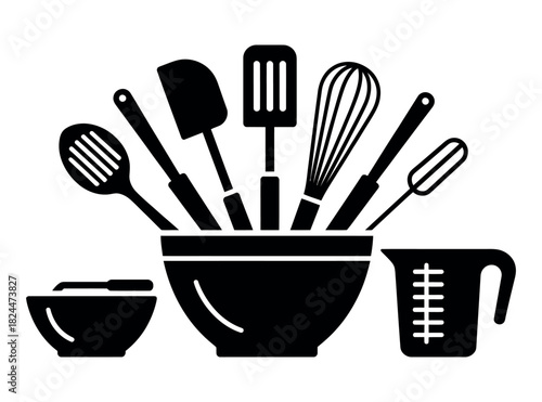 A collection of kitchen utensils are displayed in and around a bowl.