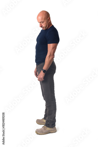 Принти на полотні side view of a man standing looking dow on white background