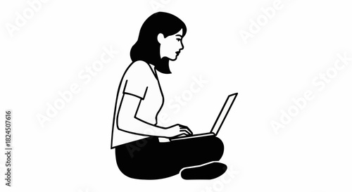 Woman working on laptop while sitting on the floor.