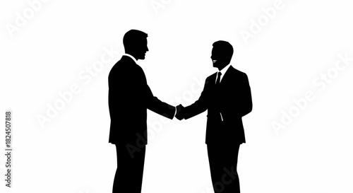 Silhouette of two businessmen shaking hands in agreement.