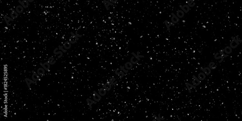 Minimal snow texture overlay featuring very few, tiny white particles scattered lightly across an isolated dark black background