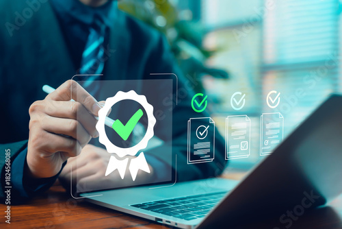 Billede på lærred Business person using a digital pen to approve a certification badge and verifie