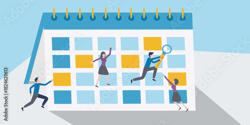 People planning and organizing tasks on a large calendar