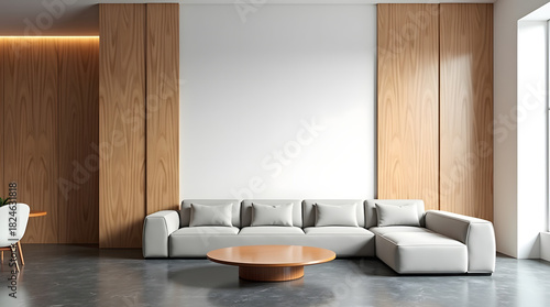 Modern living room featuring a stylish gray sectional sofa and a round wooden coffee table against a wood-paneled wall.