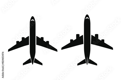 Two black airplane silhouettes facing different directions isolated on white background