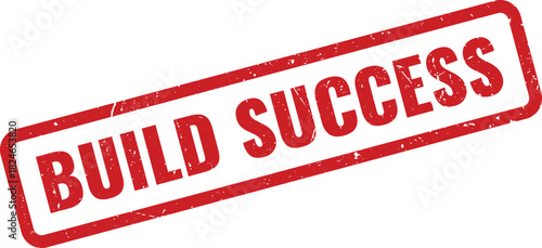 Red distressed rubber stamp clearly stating a motivational message to build success
