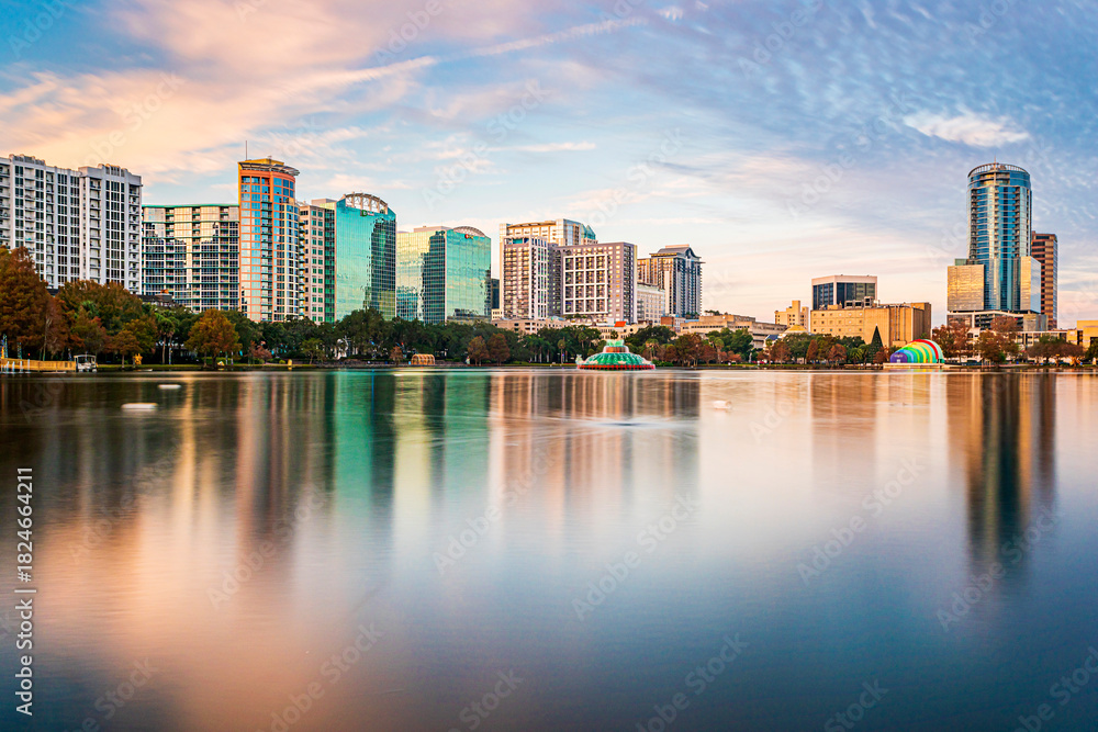 Fototapeta premium Amazing view of Orlando skyline in Florida and reflection in Lake Eola.